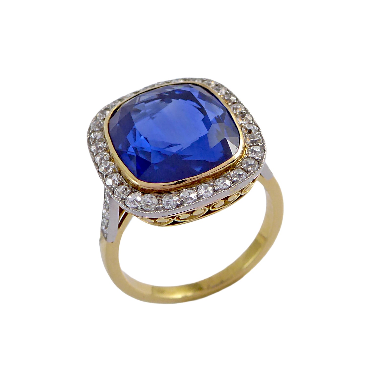 Single stone cushion cut sapphire and diamond cluster ring
